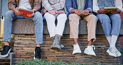 Buy stock photo Feet, students and wall with book at school for education, learning support and studying of growth development. People, legs and rest for knowledge, university and reading for morning information