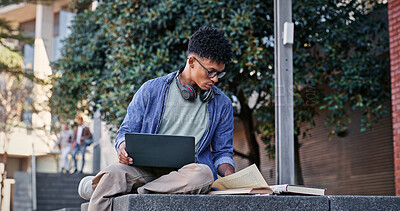 Buy stock photo Reading book, student or man on laptop for course, studying or research on internet. Education, campus or learner with headphones, school notes or technology for knowledge, university and website