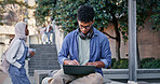 Student, glasses and typing with laptop outdoor for university project, research and information of education. Man, headphones and and typing on digital for online learning, exam results and studying