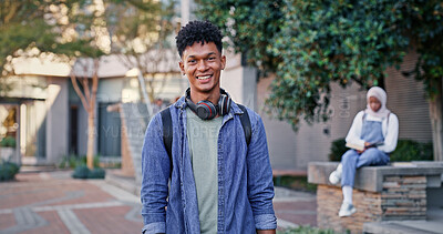 Buy stock photo Student, happy and portrait at school for education, excited and pride for academic achievement. Man, smile and headphones on campus for knowledge, development and university scholarship opportunity
