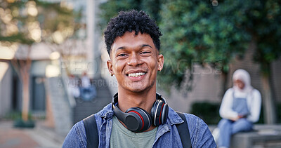 Buy stock photo Student, smile and portrait at college for education, excited and pride for academic achievement. Man, happy and headphones on campus for knowledge, development and university scholarship opportunity