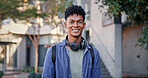 Man, smile and portrait at school for education, ambitious and pride for academic achievement. Student, happy and headphones on campus for knowledge, development and university scholarship in Brazil