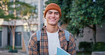 University, student and man in portrait outdoor on campus with book for education, learning and scholarship. Gen z, person and happy at college for studying, knowledge or backpack for research in USA