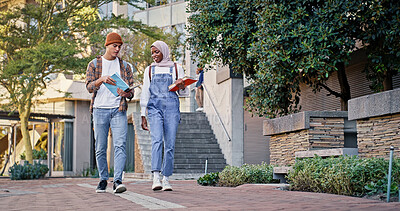 Buy stock photo College students, walking and outdoor on campus for conversation, talk and share knowledge on module. People, friends and outside for project discussion, study and together for trip to class lecture