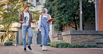 Buy stock photo University students, outdoor and walking to class together, talking and share knowledge on module. People, friends and outside for project discussion, learning and books for education assignment