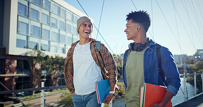 Buy stock photo Walking, students and men with education, talking and funny with humor, joke and learning. Campus, happy people and friends with smile, university and joyful with conversation, knowledge and college