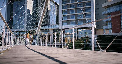 Buy stock photo City, people and bridge with buildings, sunshine and walking with break, start day and tourism. Urban town, New York and outdoor with group, fresh air and morning with architecture and engineering