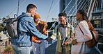 Education, handshake and group of friends, outdoor and greeting to classmate, campus and laughing. Bonding, holding hands and agreement for studying, books and students with smile, people and college