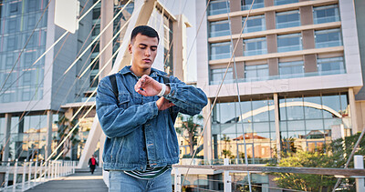 Buy stock photo Education, student and man with watch, check and serious for learning, outdoor and late for college. Backpack, person and thinking of time management, university campus and worried for punctuality