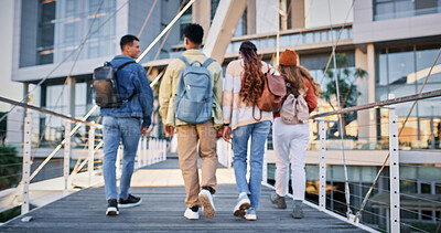 Buy stock photo Back, college and students with people and walking for education, learning and knowledge. University, academy and youth development with friends on campus for scholarship, school and studying