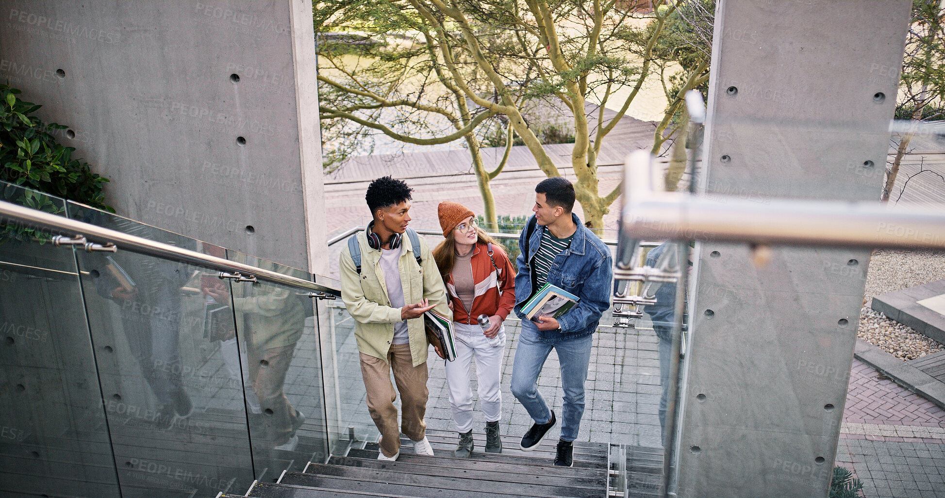 Buy stock photo Conversation, study and walking with friends on stairs at college or university campus for learning. Development, education or growth with man and woman students outdoor at school together for future