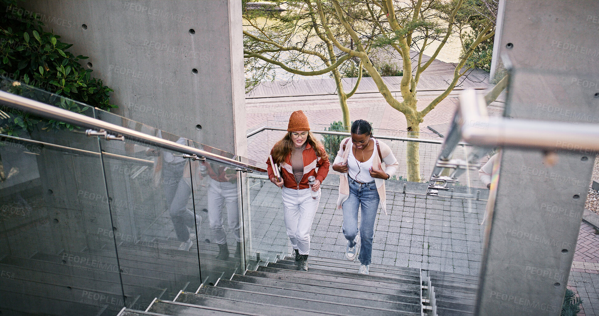 Buy stock photo Conversation, education and walking with students on stairs at college or university campus for learning. Development, growth and study with woman friends outdoor at school together for future