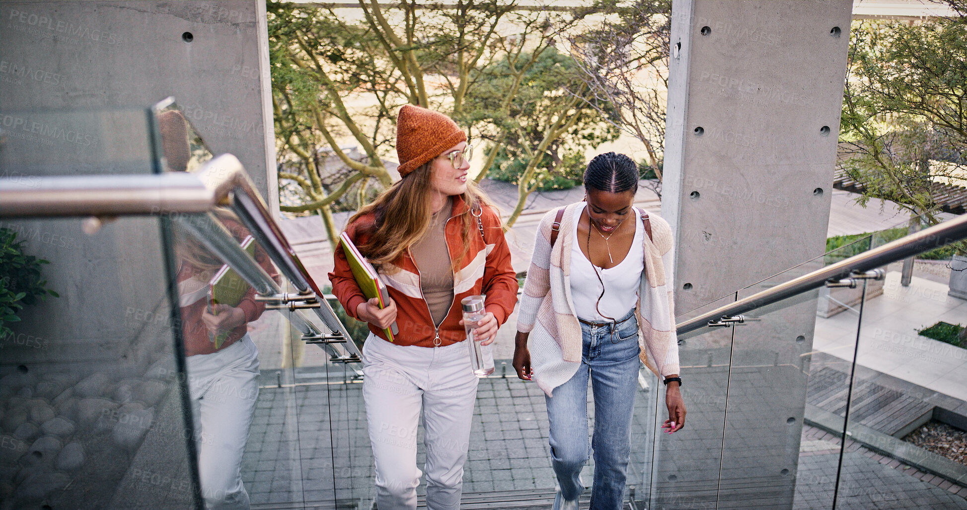 Buy stock photo Chatting, education and walking with friends on stairs at college or university campus for learning. Development, growth and talking with woman students outdoor at school together for future or study