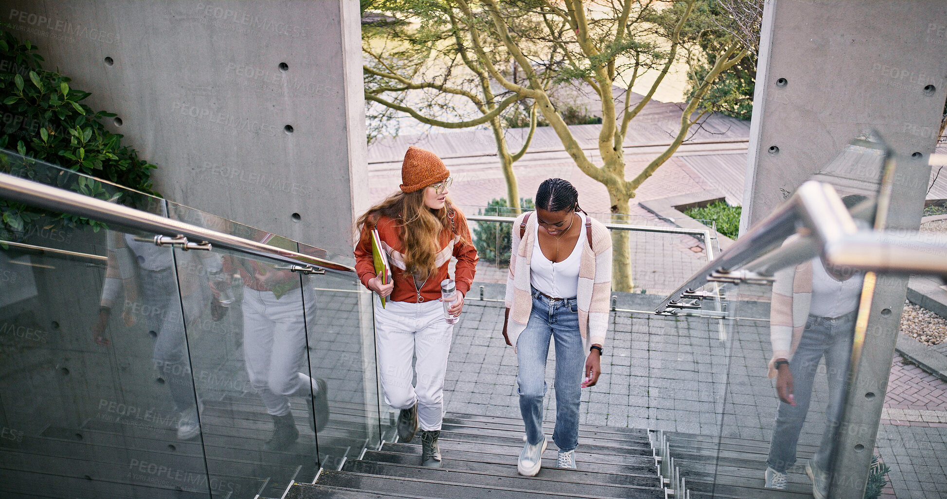 Buy stock photo Conversation, education and walking with women on stairs at college or university campus for learning. Development, growth and study with student friends outdoor at school together for future