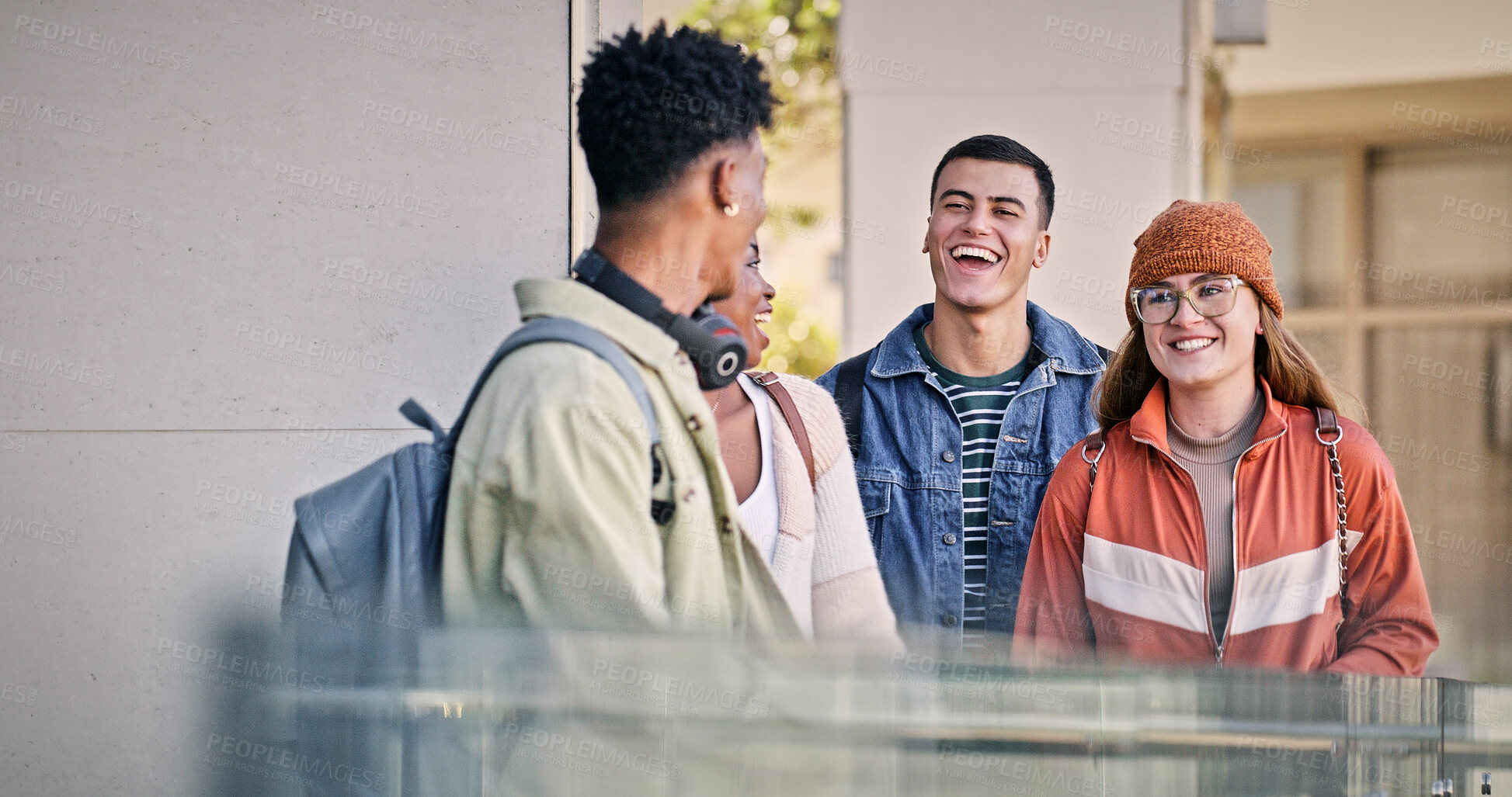 Buy stock photo Students, walking and laugh at university for education, new semester and funny storytelling. People, friends and talking on campus for catch up, gossip and joking with diversity in community college