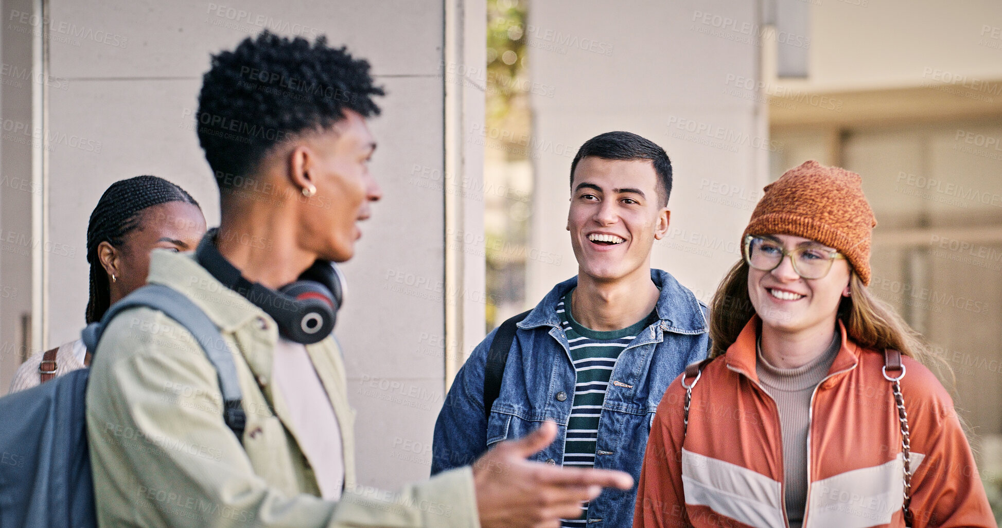 Buy stock photo Students, walking and happy at university for education, new semester or funny storytelling. People, friends and laughing on campus for catch up, gossip and joking with diversity in community college