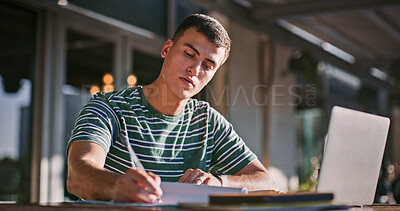 Buy stock photo Man, university student and outdoor with laptop or writing on notebook for assignment on campus. Male person, college learner and textbook for education with research or study for exam and assessment