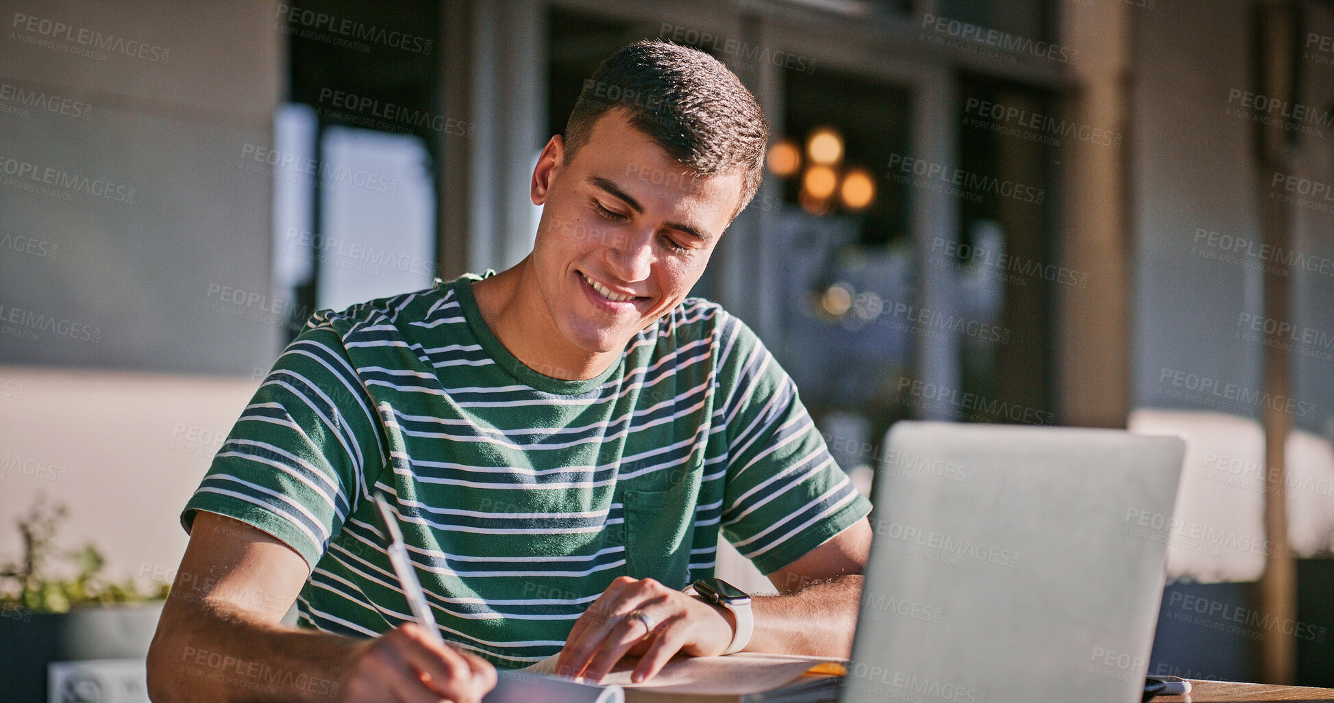 Buy stock photo Man, university student and happy with laptop or writing on notebook for assignment on campus. Male person, college learner and textbook for education with research or study for exam and assessment