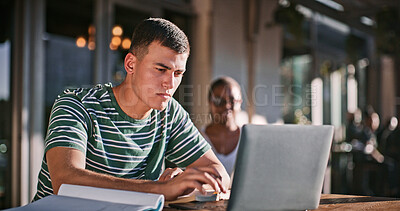 Buy stock photo Man, university student and campus with reading on laptop for assignment and essay writing. Male person, college learner and textbook for education with research or study for exam and assessment