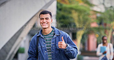 Buy stock photo Thumbs up, university and student in park for scholarship, education and future goals with portrait smile. Happy man, college or academy campus with like or yes hand sign for school approval gesture