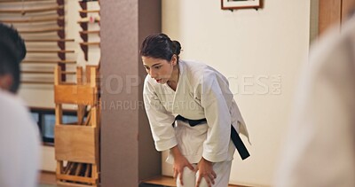 Buy stock photo Martial arts, woman and bow with respect in dojo for honor, self defense training and discipline in class. Japanese culture, aikido and person with traditional greeting for etiquette and gratitude