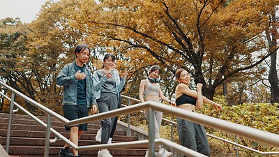 Buy stock photo Fitness, friends and exercise in morning, steps and personal trainer with tips for women and smile. Outdoor, man and routine with people, workout and warm up for marathon, runner and happy in Japan