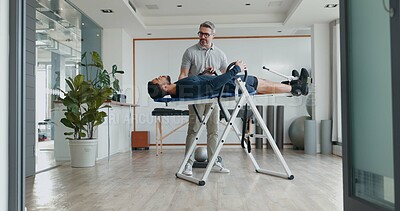 Buy stock photo Physiotherapist, man and recovery on fitness bench with exercise, help and progress at clinic. People, biokinetics and support on table for rehabilitation process with injury treatment at hospital