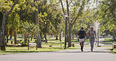 Buy stock photo Fitness, elderly couple and running in park for training, cardio exercise and wellness in retirement. Senior interracial people, smile outdoor or workout support, motivation or friends with energy