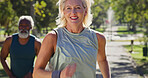 Park, couple and happy for running with fitness for self care, wellness and health. Mature people, interracial and smile or satisfied with jogging outdoor in relationship with exercise and workout 