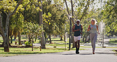 Buy stock photo Fitness, elderly couple and running in park for wellness, cardio exercise and training in retirement. Senior people, smile and outdoor for workout with support, motivation and interracial friends
