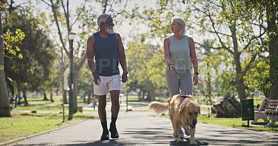 Buy stock photo Park, couple and smile for walking with dog for fitness, exercise and workout for health. Outdoor, interracial and mature people in relationship with pet or animal for support, care and bonding