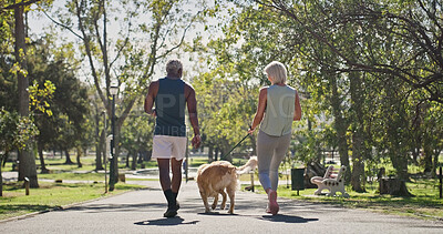 Buy stock photo Park, couple and walking with dog for fitness together as exercise, workout and health as lovers. Outdoor, back and mature people in relationship with pet or animal for support, care and bonding