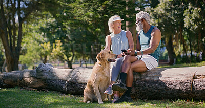 Buy stock photo Mature couple, dog and park with phone and chat in retirement with social media and pet. Morning, love and care of interracial relationship with animal, fitness break and tech with golden retriever