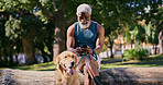App, dog walking and phone with black man in park for cardio exercise, fitness or health hobby. Obedience, pet performance and smile of mature animal owner in nature for communication or workout