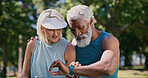 Break, fitness and watch with mature couple in park together for exercise, running or training. Rest, time or tracking with interracial man and woman outdoor for cardio, health or wellness activity