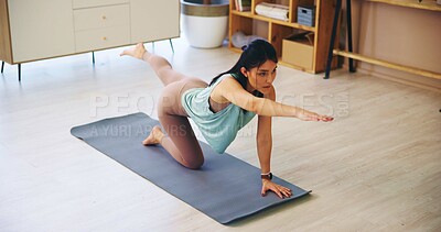 Buy stock photo Fitness, yoga and woman with stretching on floor for core muscle strength, flexibility and improve posture. Yogi, person and dog bird pose in home for pilates, balance and stability with mindfulness