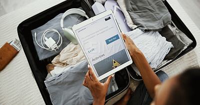 Buy stock photo Woman, hands or tablet screen with suitcase for vacation, holiday or browsing website above at home. Top view, female person and technology with display or luggage for online getaway or accommodation