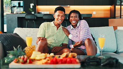 Buy stock photo Laugh, portrait and couple on sofa in home watching tv for movie, film or show together for date. Platter, mimosas and man with woman for relaxing and streaming series in living room in house.