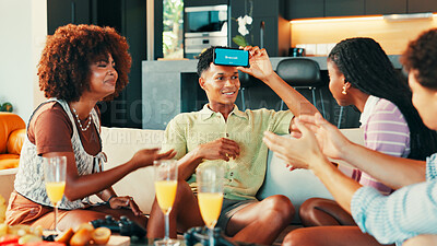 Buy stock photo App, game and phone with friends in living room of home together for bonding or social gathering. Action, explain and guess with people acting in apartment for challenge, competition or reunion
