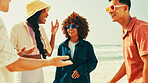 Smile, talking and group of friends on beach for summer vacation, travel reunion and funny discussion. People, laughing and sunglasses for tropical holiday, bonding together and sea tourism on island