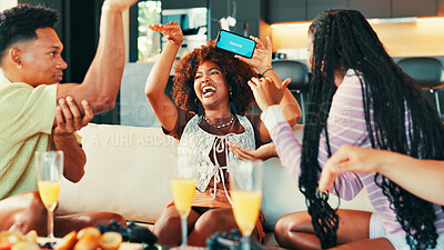 Buy stock photo Party, friends and phone in home for game, laugh and together for competition at social gathering. Happy group, mobile and people play charades, guess word or funny challenge with clues on screen