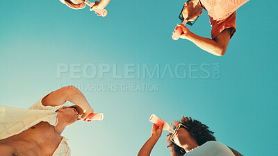 Buy stock photo People, drinks and sky with friends, low angle and outdoor on vacation, break and event in summer. Men, women and bottle for soda with party, solidarity and nature with social group on holiday