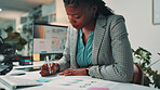 Black woman, documents and writing by computer in office for project, admin and review for proposal. Person, paperwork and graphs for research, planning or feedback for perspective at creative agency