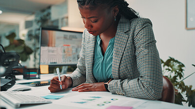 Buy stock photo Black woman, documents and writing by computer in office for project, admin and review for proposal. Person, paperwork and graphs for research, planning or feedback for perspective at creative agency