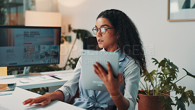Buy stock photo Woman, tablet and reading by computer in office for project, admin and review for proposal. Person, technology and pc for research, planning or feedback for perspective for creative agency management