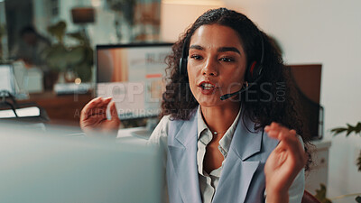 Buy stock photo Video call, night and business woman on computer for virtual meeting, talking and interview. Media agency, communication and person with headset for discussion, webinar and customer service in office