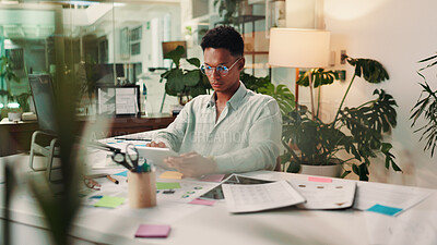 Buy stock photo Creative, night or man on tablet in startup for social media campaign, trends and business ads. App, late or content strategist in agency for online review, performance or branding design research