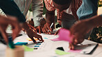 People, hands or meeting with documents for planning, schedule or brainstorming together at office. Closeup, group or team working with paperwork or sticky note for sharing ideas on creative strategy