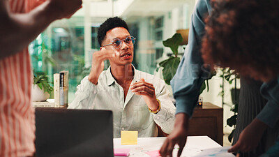 Buy stock photo Businessman, discussion and laptop with team for collaboration, explanation or planning at office. Male person, conversation or explaining tasks with colleagues or group for project agenda or design