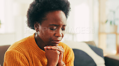 Buy stock photo Stress, sad or black woman with depression in home for trauma, broken heart and mental health challenge. Living room, crisis or unhappy person with anxiety for disaster, regret mistake and loneliness